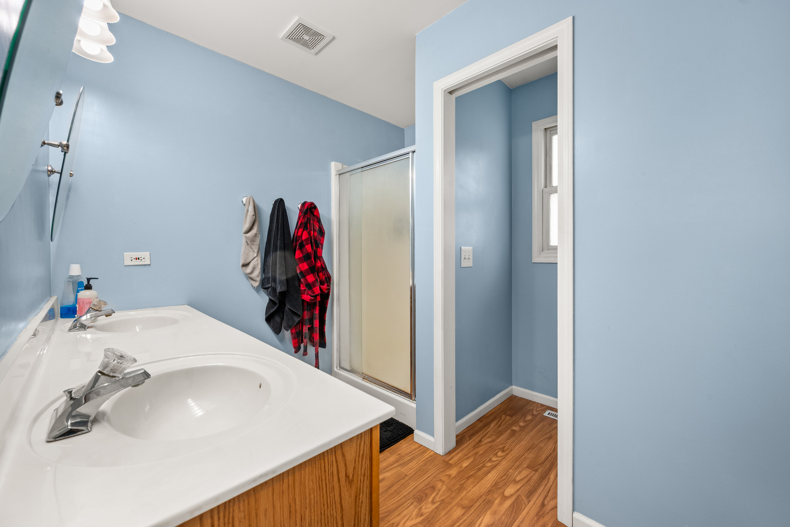 323 West Church Street Genoa, IL 60135 - Photo 17 of 28 a bathroom with a sink and a mirror
