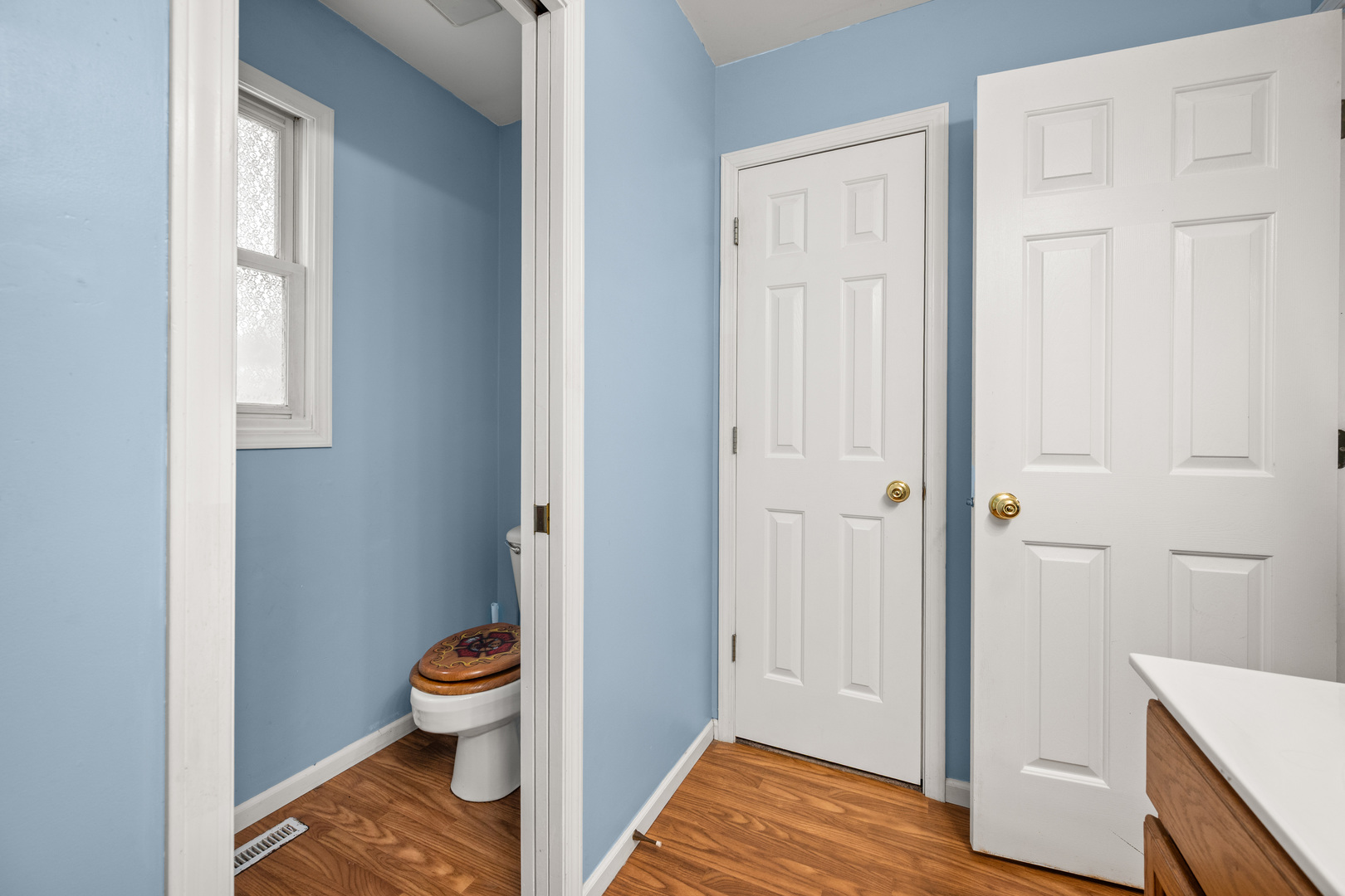 323 West Church Street Genoa, IL 60135 - Photo 19 of 28 a bathroom with a sink and a toilet