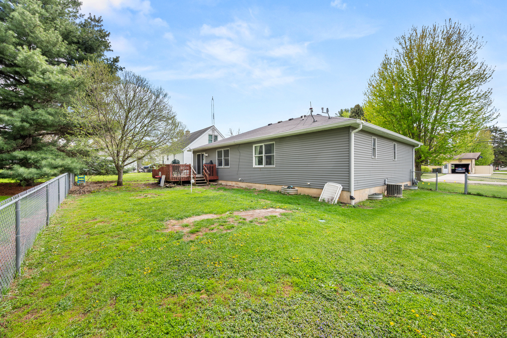 323 West Church Street Genoa, IL 60135 - Photo 23 of 28 a front view of house with yard and green space