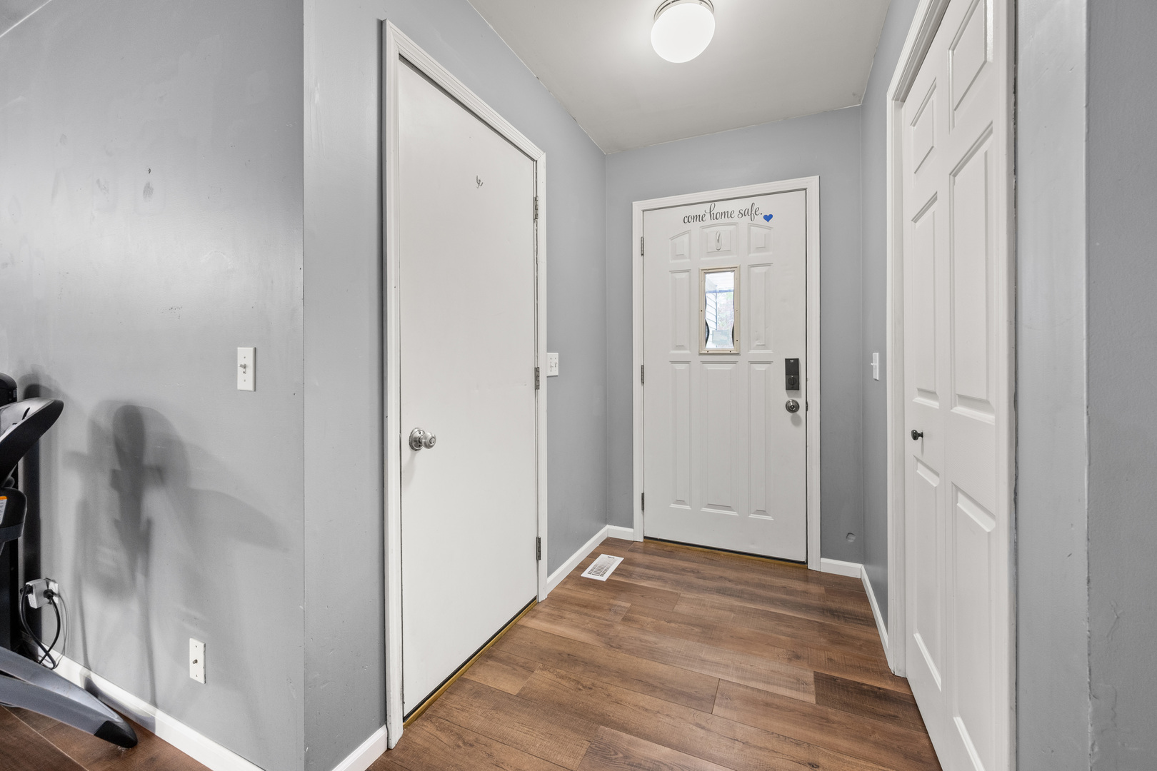 323 West Church Street Genoa, IL 60135 - Photo 4 of 28 a view of a hallway with wooden floor