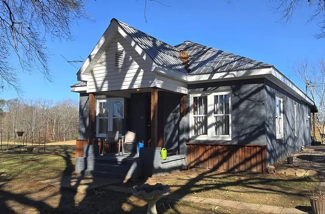 a view of a house with a tree