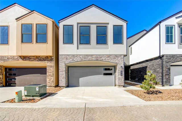 a front view of a house with yard