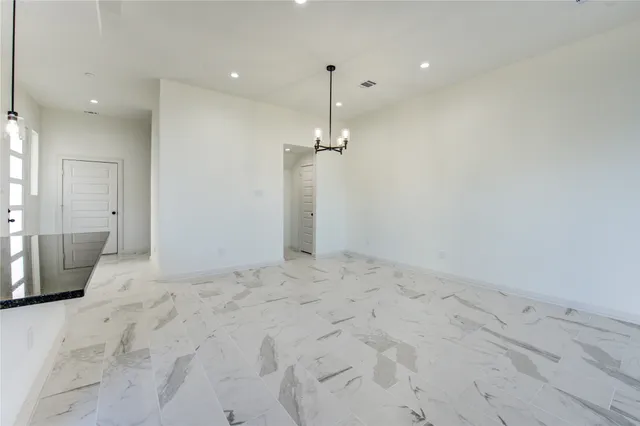 a view of a room with a chandelier