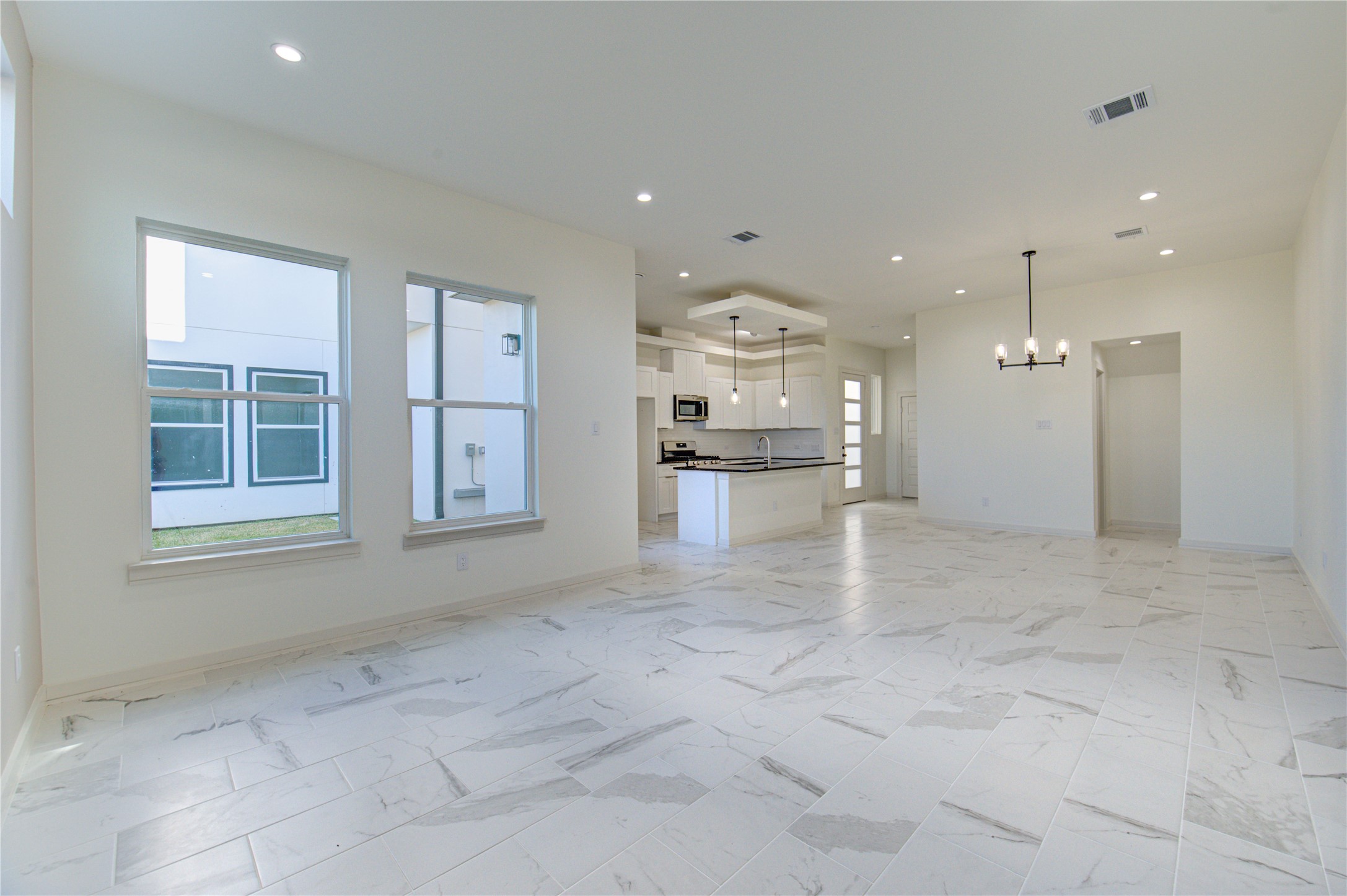 2930 El Fenice Lane Houston, TX 77057 - Photo 12 of 37 a view of a kitchen with refrigerator and windows