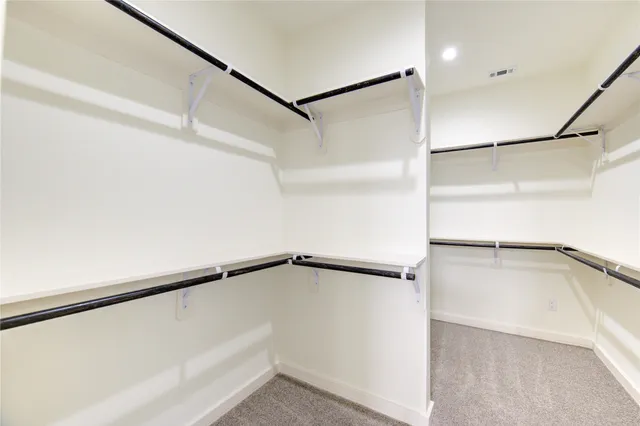 a view of an empty walk in closet