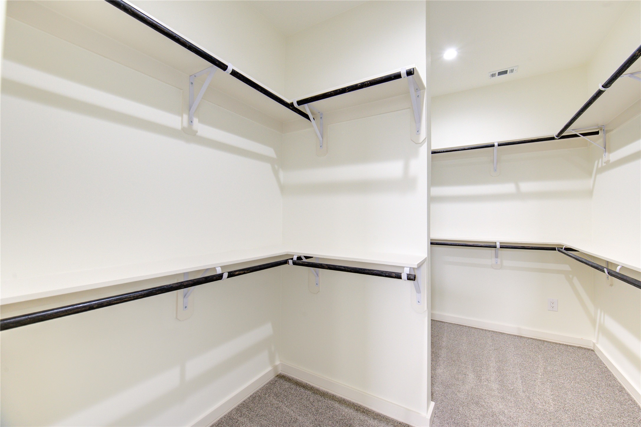 2930 El Fenice Lane Houston, TX 77057 - Photo 17 of 37 a view of an empty walk in closet