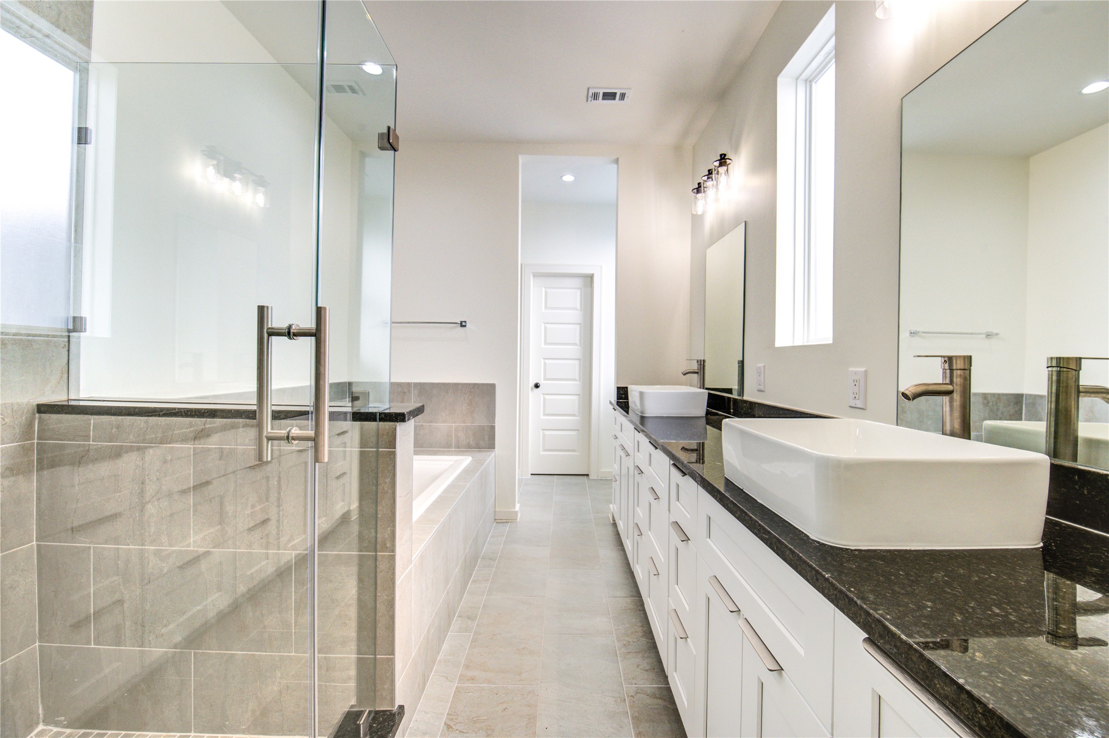 2930 El Fenice Lane Houston, TX 77057 - Photo 24 of 37 a large white kitchen with a lot of counter space and a sink