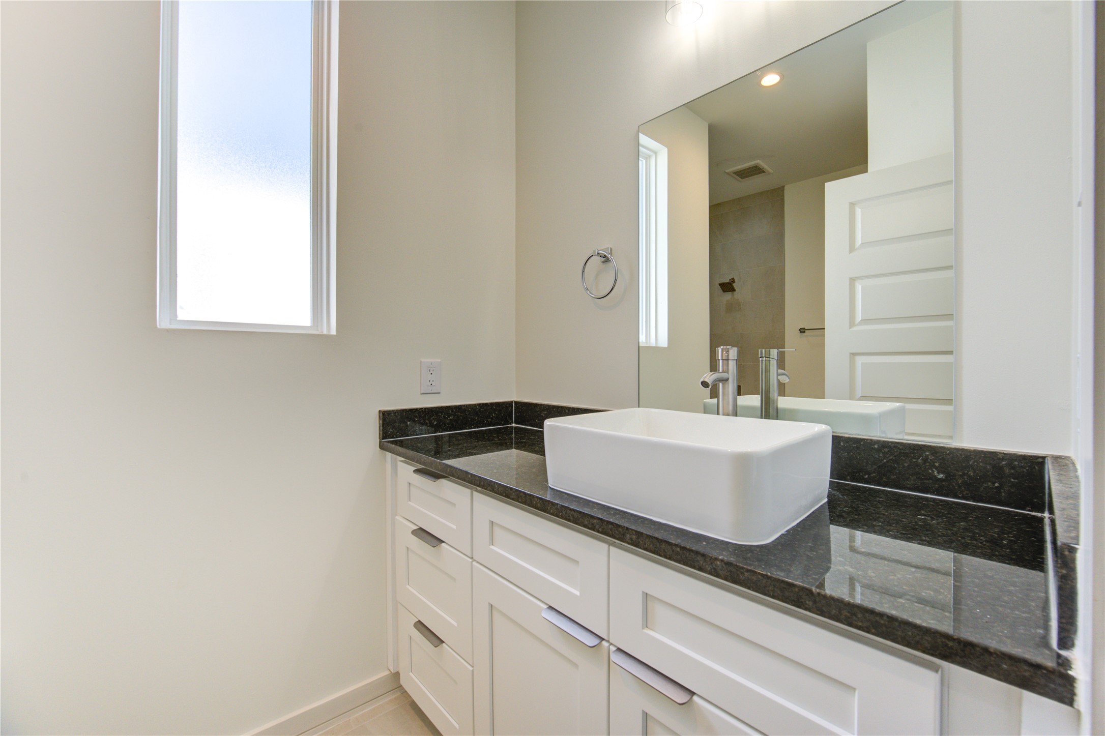 2930 El Fenice Lane Houston, TX 77057 - Photo 29 of 37 a bathroom with a granite countertop sink and a mirror