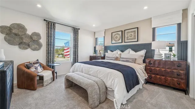 a bedroom with a bed and a couch