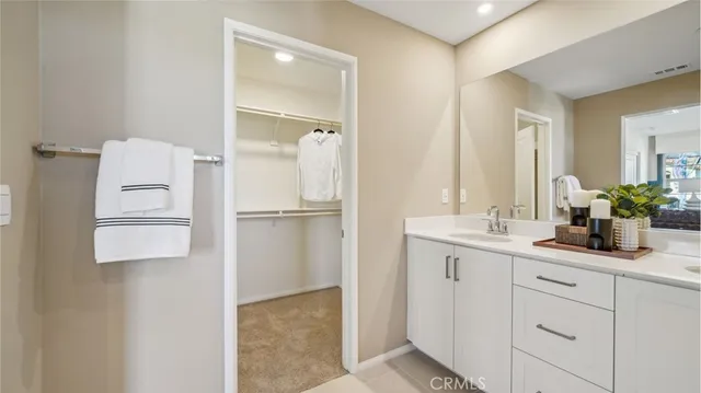 a bathroom with a double vanity sink and mirror