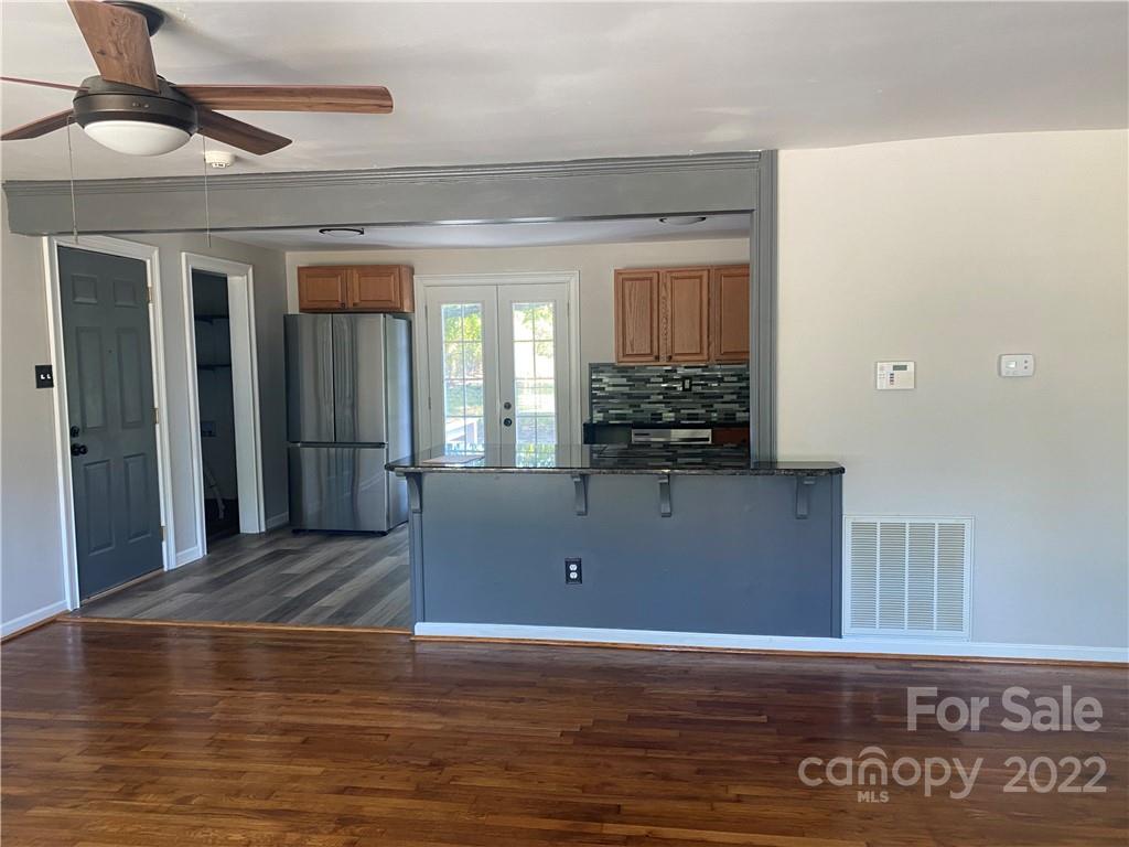 1911 Beacon Road Lancaster, SC 29720 - Photo 3 of 19 a view of a room with wooden floor and potted plant