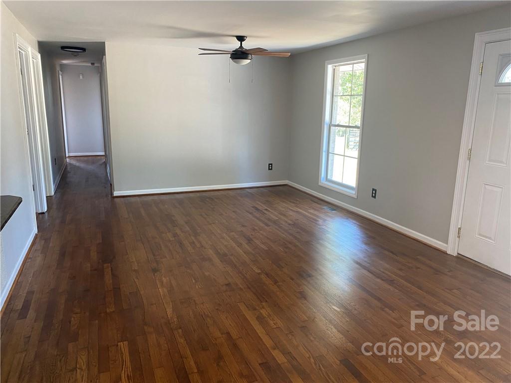 1911 Beacon Road Lancaster, SC 29720 - Photo 4 of 19 an empty room with wooden floor and windows