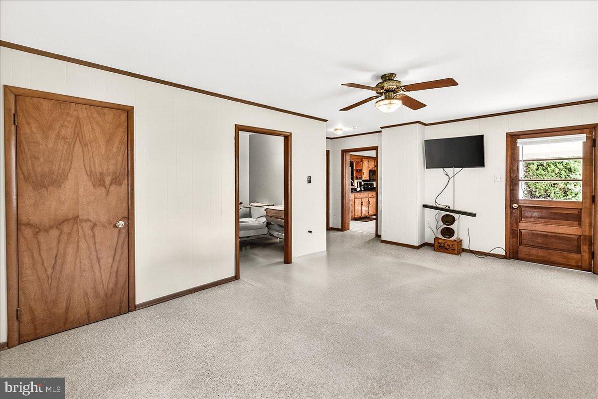 11804 Pleasant Walk Road Myersville, MD 21773 - Photo 20 of 49 a view of a livingroom with furniture and a ceiling fan