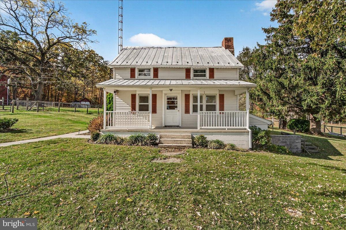 11804 Pleasant Walk Road Myersville, MD 21773 - Photo 2 of 49 a front view of house with yard and trees around