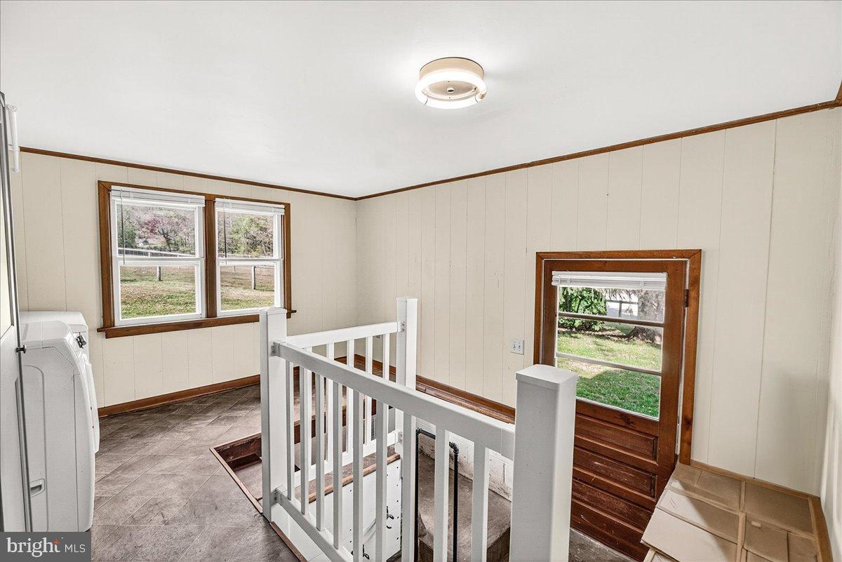 11804 Pleasant Walk Road Myersville, MD 21773 - Photo 24 of 49 a view of hallway with wooden floor and stairs