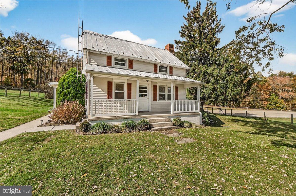11804 Pleasant Walk Road Myersville, MD 21773 - Photo 3 of 49 a house with trees in front of it