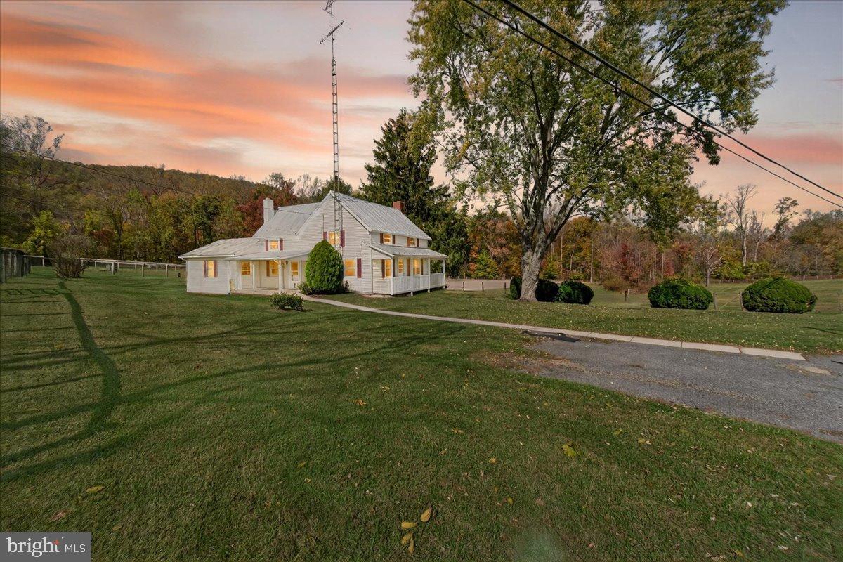11804 Pleasant Walk Road Myersville, MD 21773 - Photo 4 of 49 a view of a white house in a big yard with large trees