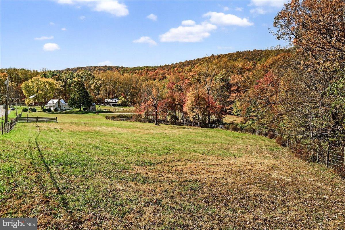 11804 Pleasant Walk Road Myersville, MD 21773 - Photo 43 of 49 a view of a field with an trees in the background