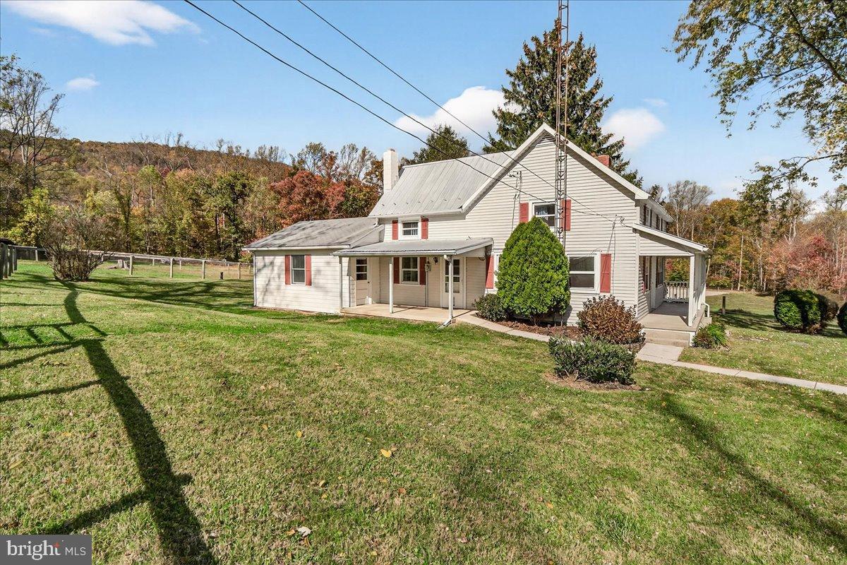 11804 Pleasant Walk Road Myersville, MD 21773 - Photo 7 of 49 a front view of a house with a yard