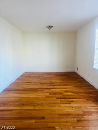 a view of room and wooden floor