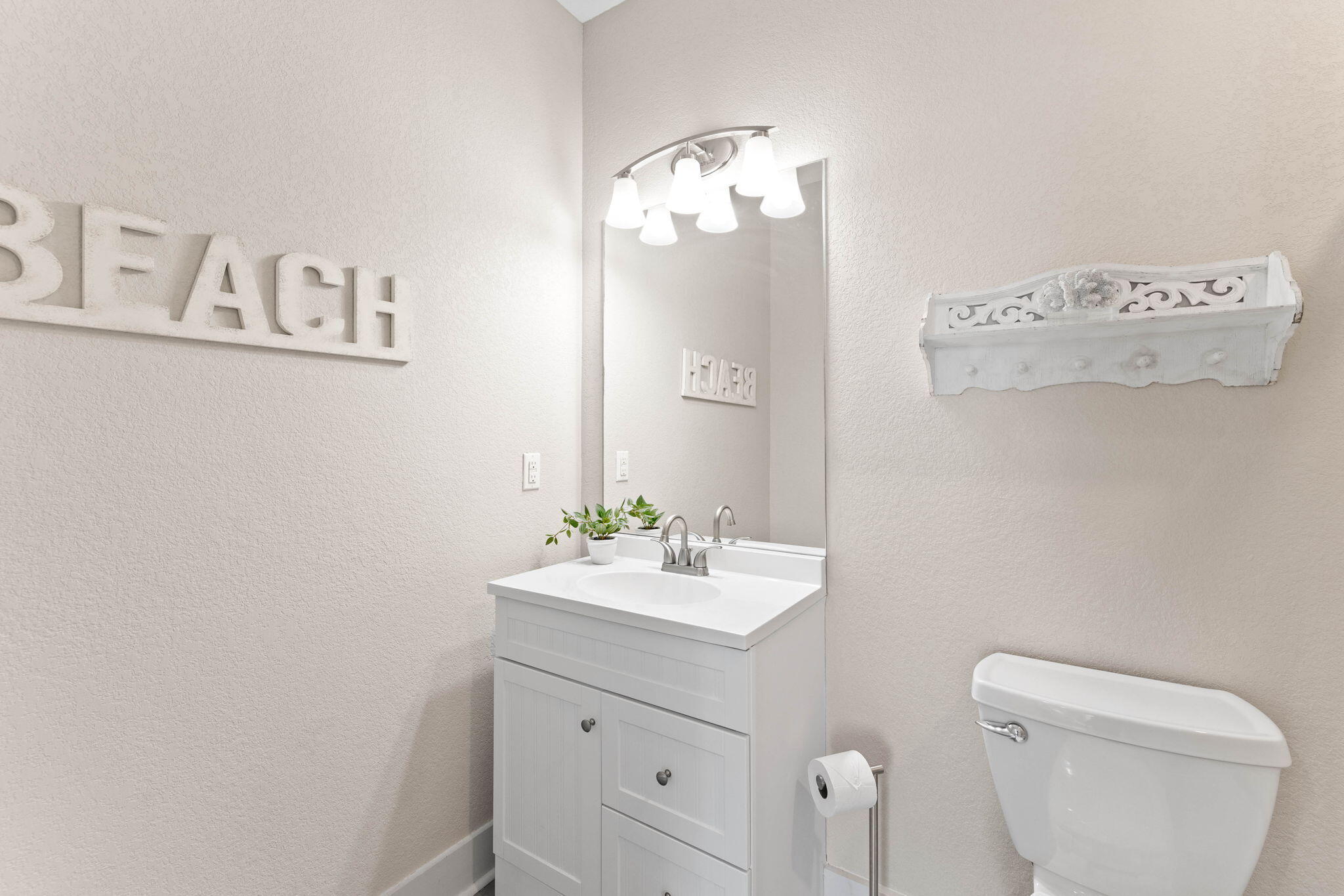 22 Mobile Street Miramar Beach, FL 32550 - Photo 13 of 55 a bathroom with a sink mirror and toilet