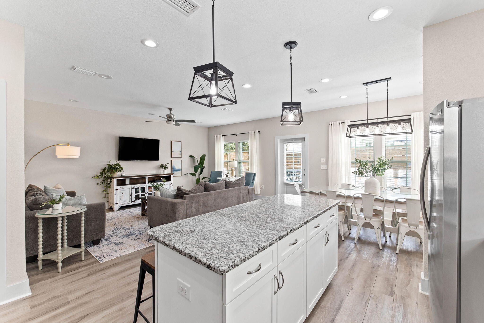 22 Mobile Street Miramar Beach, FL 32550 - Photo 21 of 55 a kitchen with stainless steel appliances granite countertop living room and stove