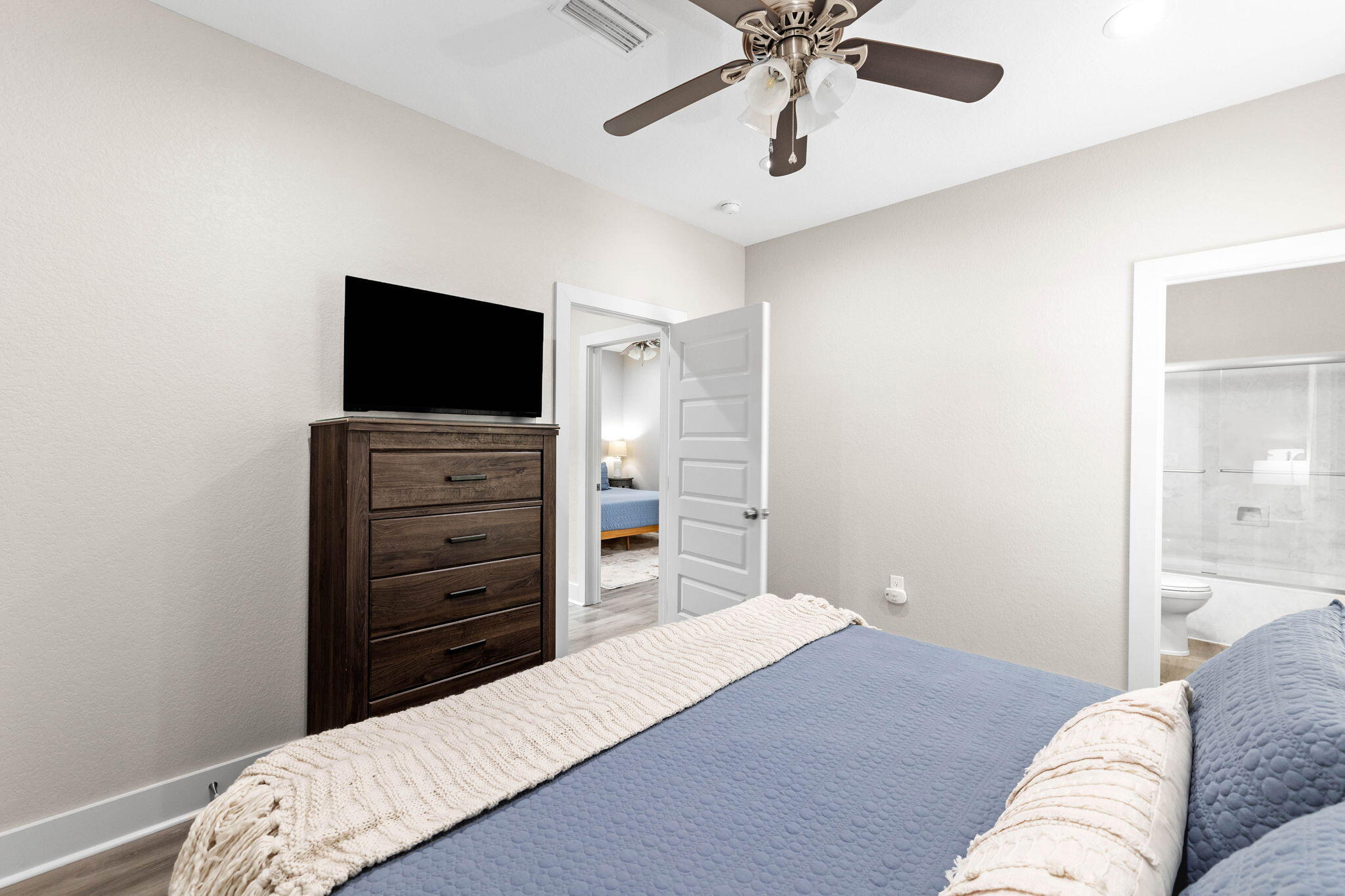 22 Mobile Street Miramar Beach, FL 32550 - Photo 32 of 55 a bedroom with a bed and a television