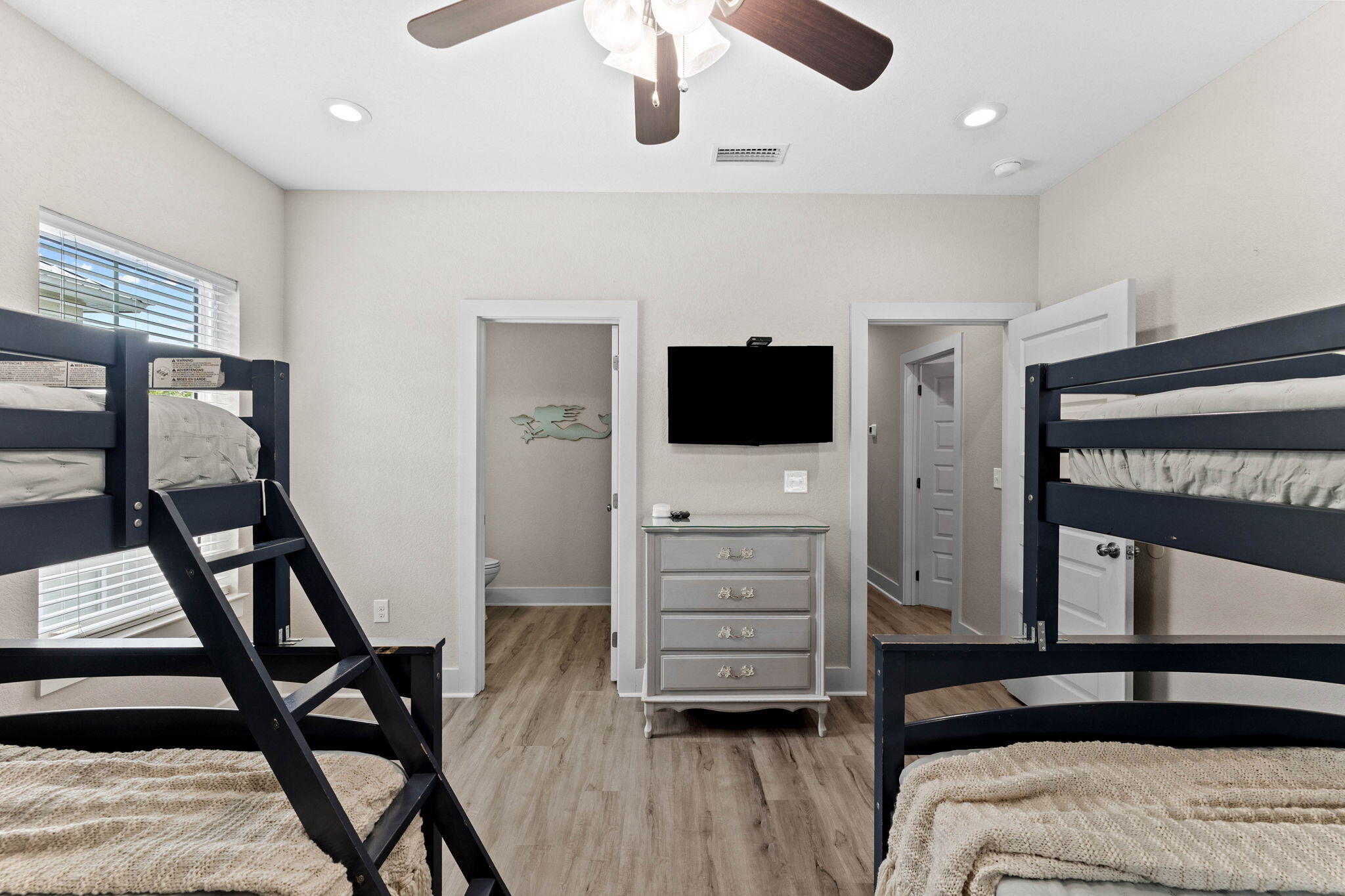 22 Mobile Street Miramar Beach, FL 32550 - Photo 38 of 55 a bedroom with furniture and a flat screen tv