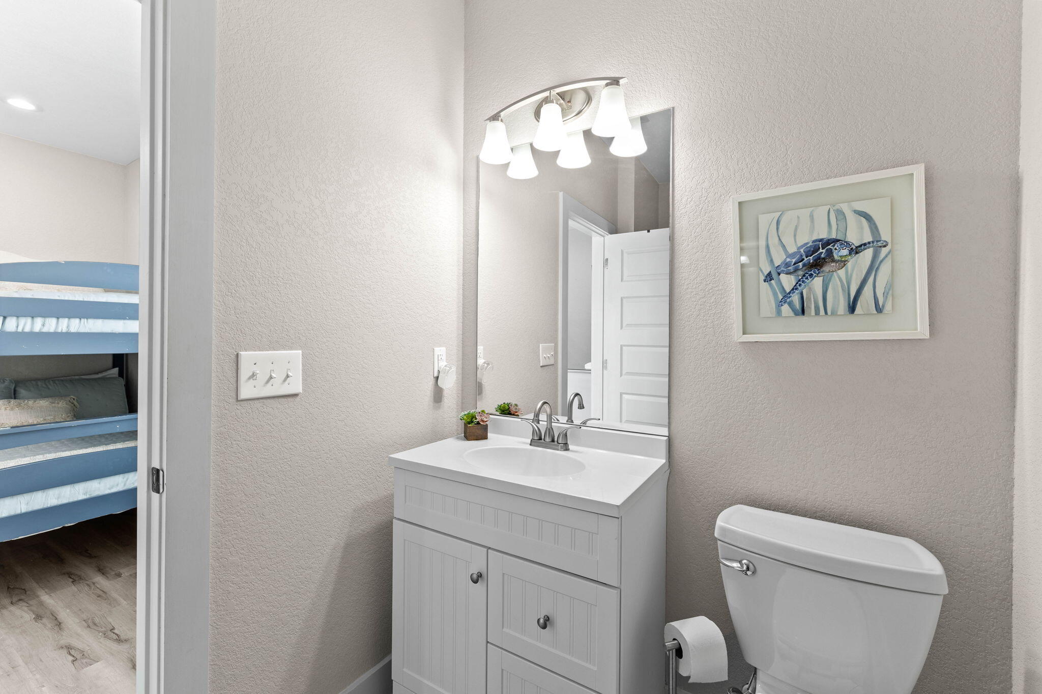 22 Mobile Street Miramar Beach, FL 32550 - Photo 39 of 55 a bathroom with a toilet a sink and mirror