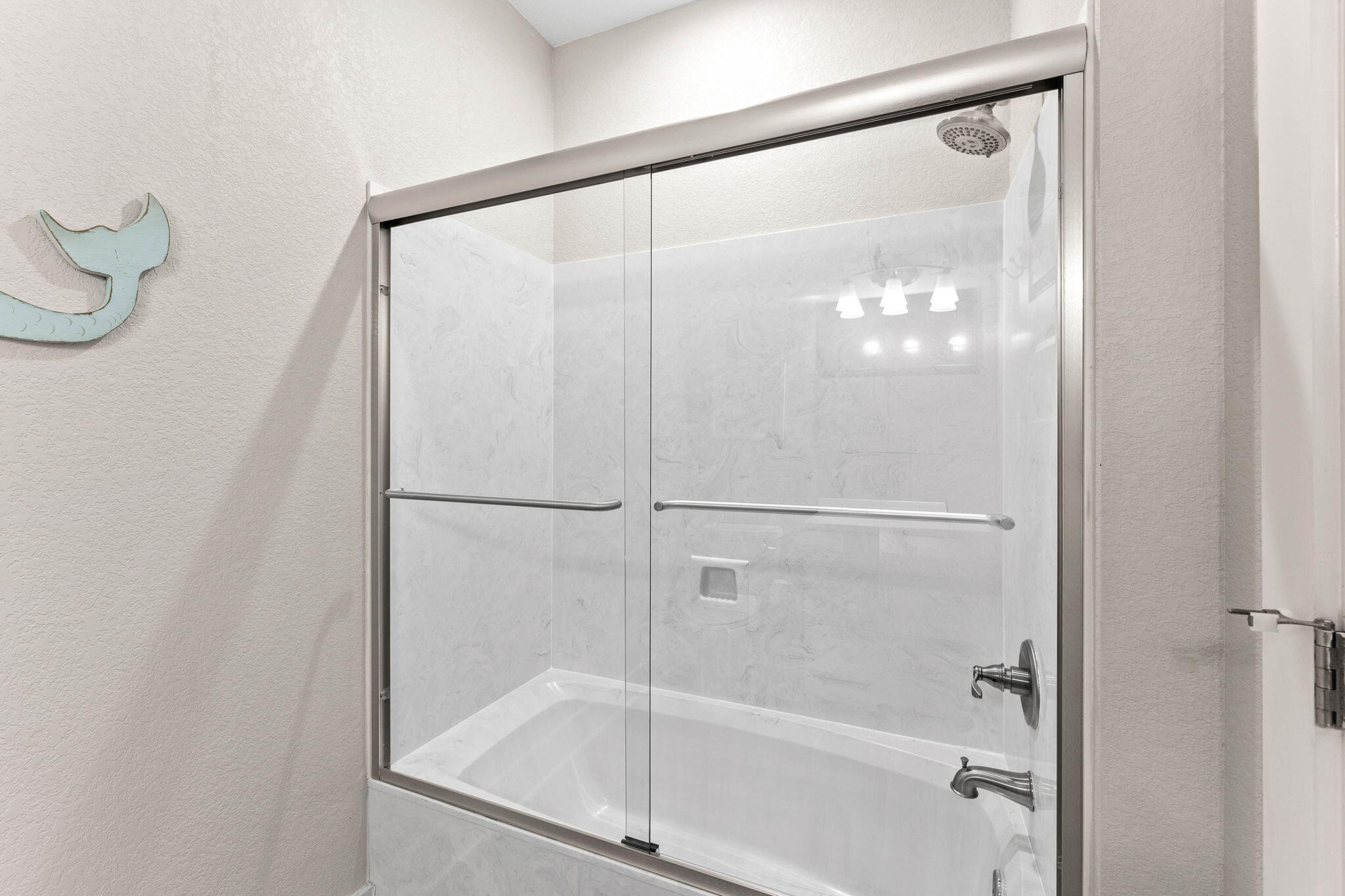 22 Mobile Street Miramar Beach, FL 32550 - Photo 40 of 55 a bathroom with a glass shower door