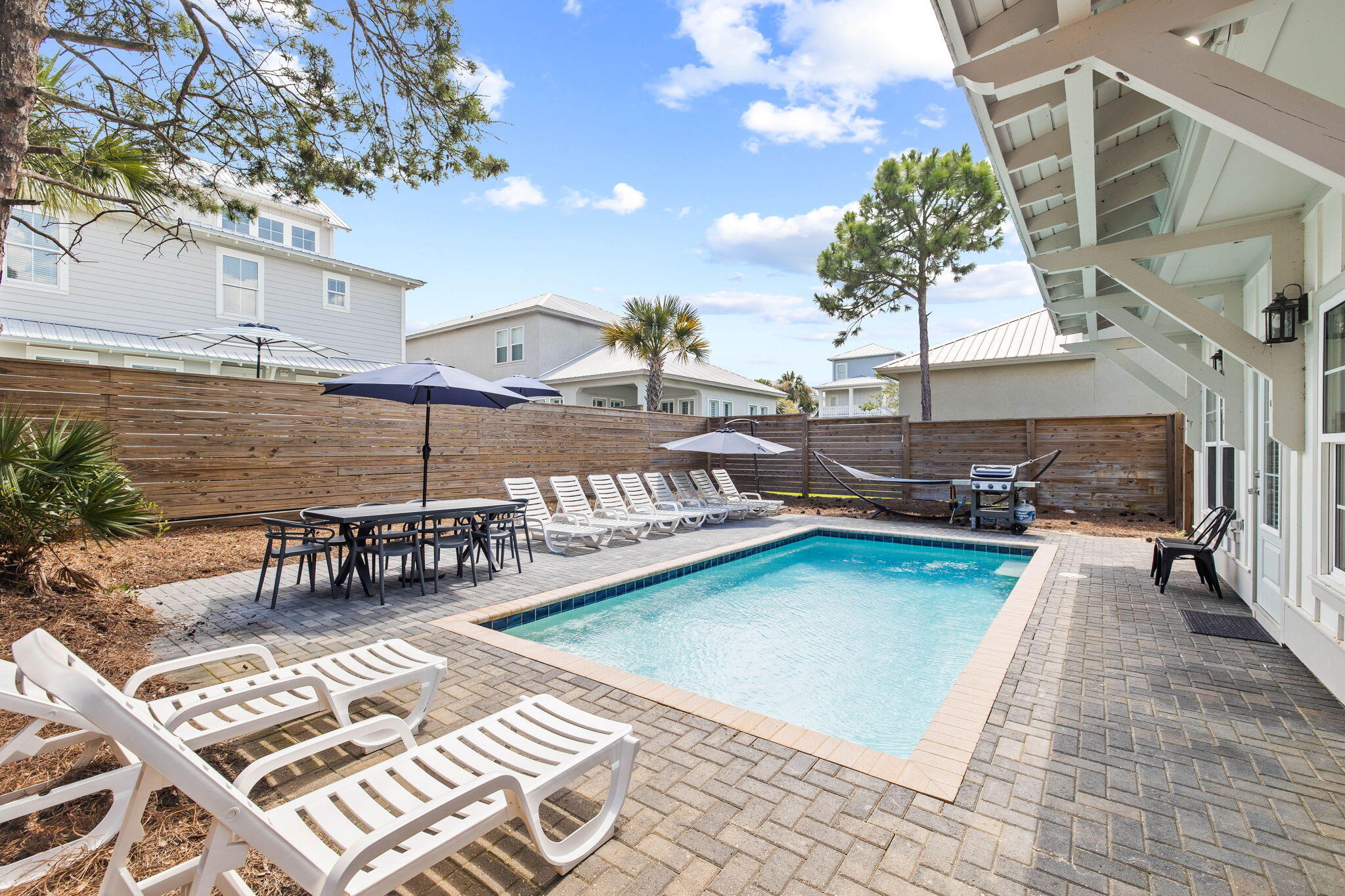 22 Mobile Street Miramar Beach, FL 32550 - Photo 43 of 55 a view of a swimming pool with a lounge chairs