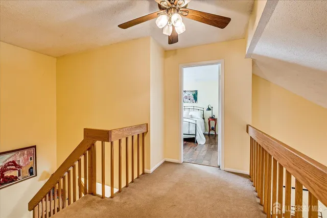 a view of hallway with livingroom