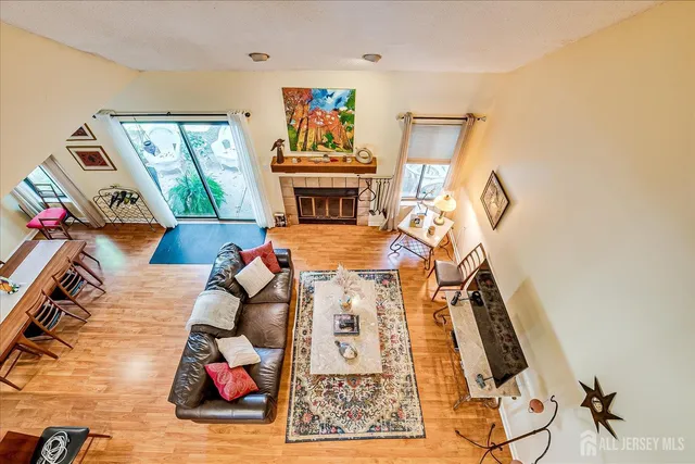 a view of living room with furniture and wooden floor