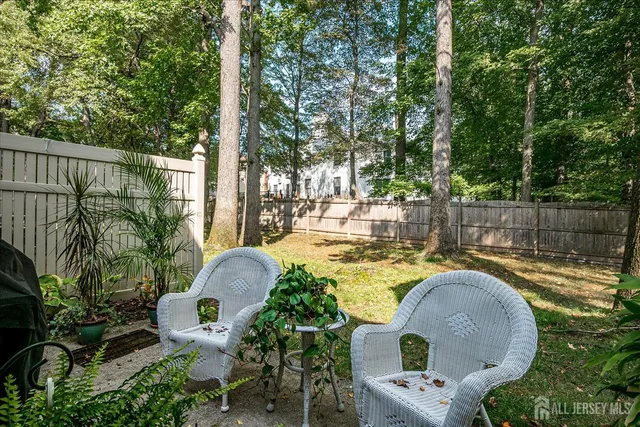 a swimming pool with outdoor seating and yard