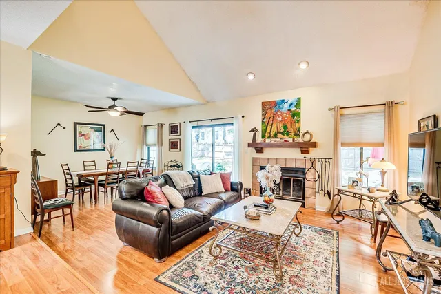 a living room with furniture or dining table and a fireplace