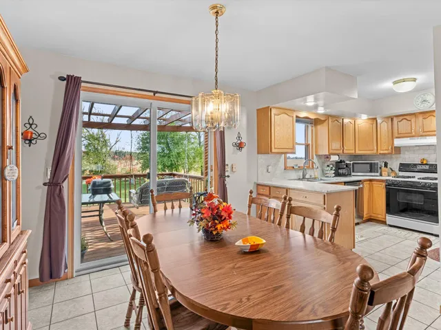 a dining room filled counter top space and a dining table with chairs