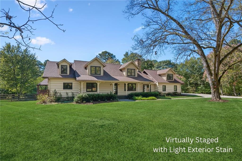 a front view of house with yard and green space