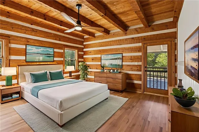 a bedroom with a large bed and a large window