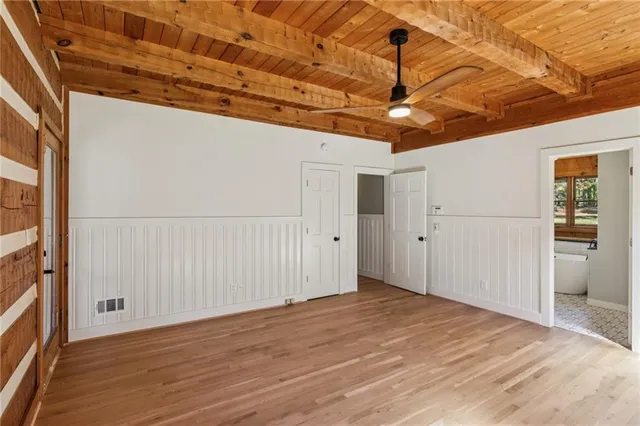 a view of a room with a wooden floor