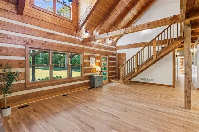 a view of an entryway with wooden floor