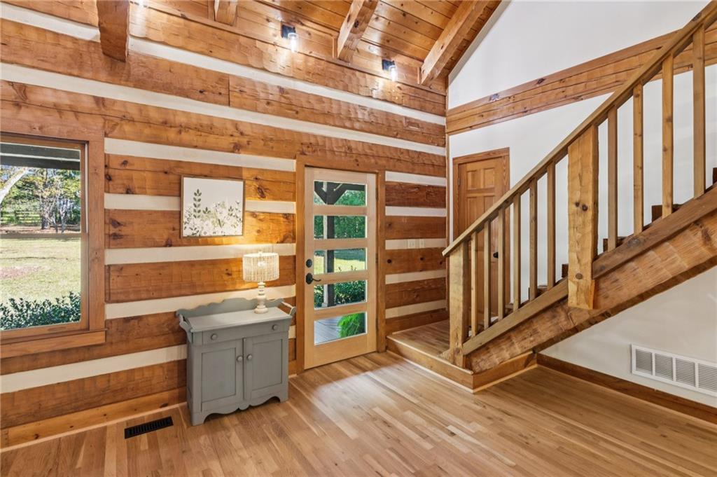 2905 Cammie Wages Road Dacula, GA 30019 - Photo 28 of 55 a view of a large room with wooden floor and stairs