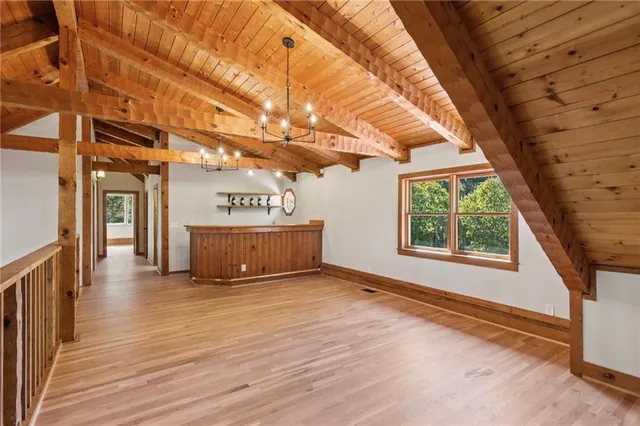 a view of a room with stairs and a large window