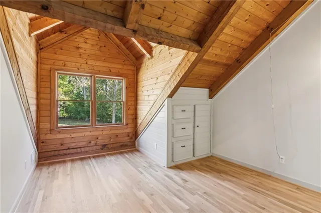 a view of room with window and hardwood floor