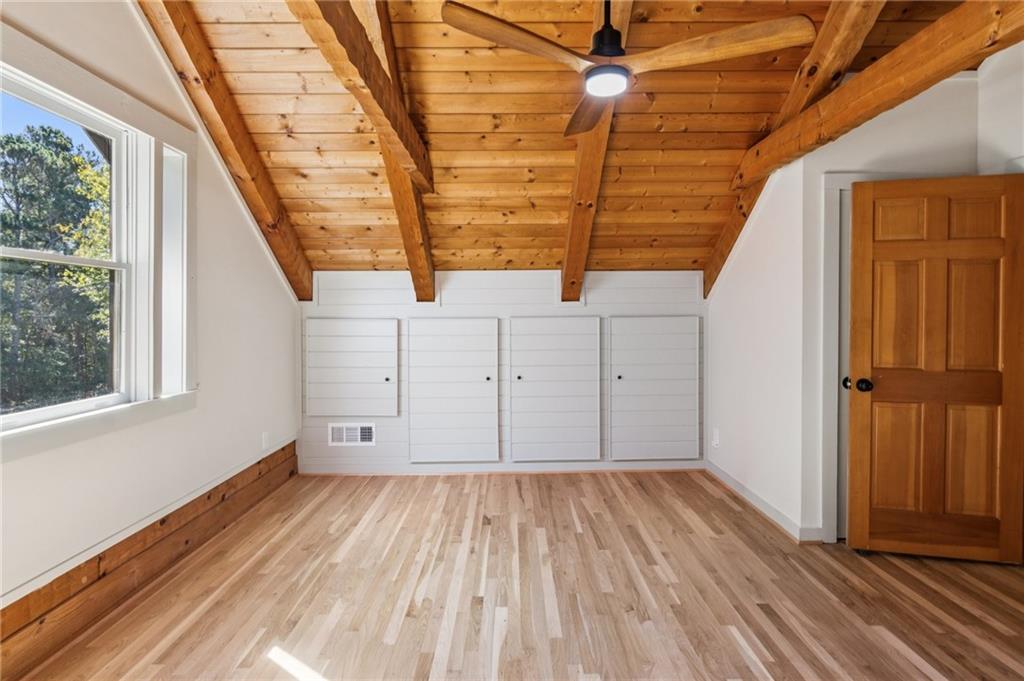 2905 Cammie Wages Road Dacula, GA 30019 - Photo 37 of 55 a view of a room with wooden floor and white walls
