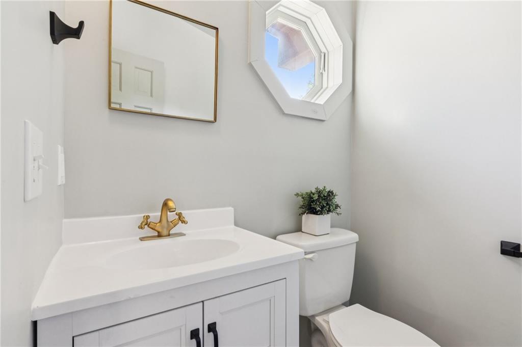 2905 Cammie Wages Road Dacula, GA 30019 - Photo 46 of 55 a bathroom with a sink and a mirror