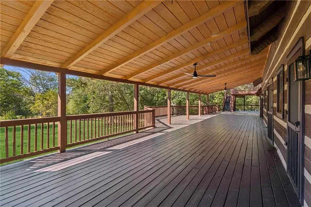 a view of balcony with wooden floor and outdoor seating