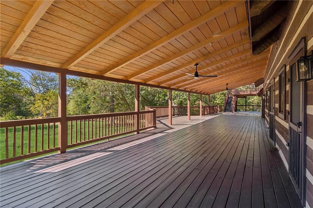 2905 Cammie Wages Road Dacula, GA 30019 - Photo 47 of 55 a view of a wooden deck with a yard