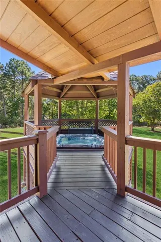 a view of a grassy field with trees