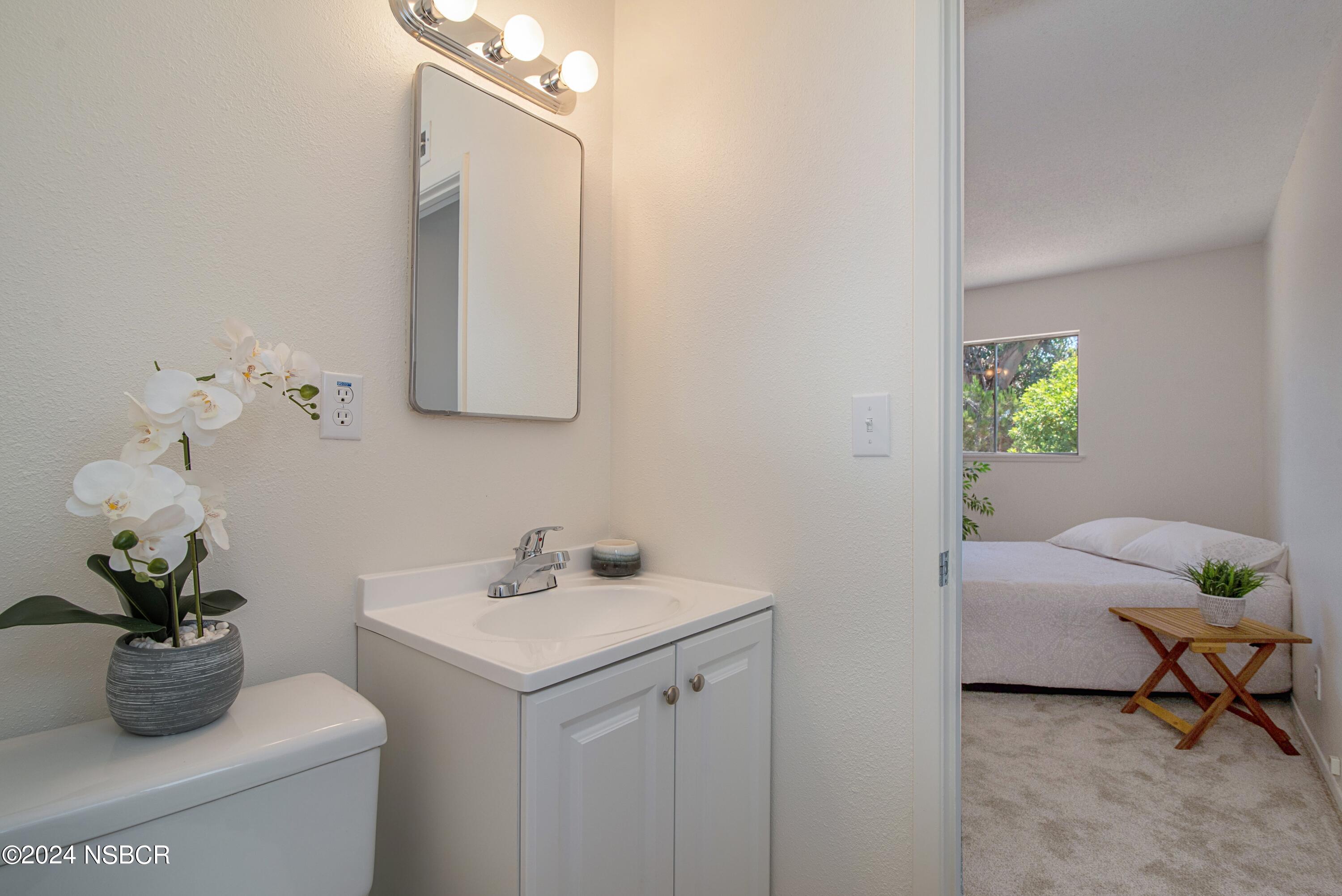 3380 Via Elba Lompoc, CA 93436 - Photo 11 of 23 a bathroom with a sink a toilet and a mirror