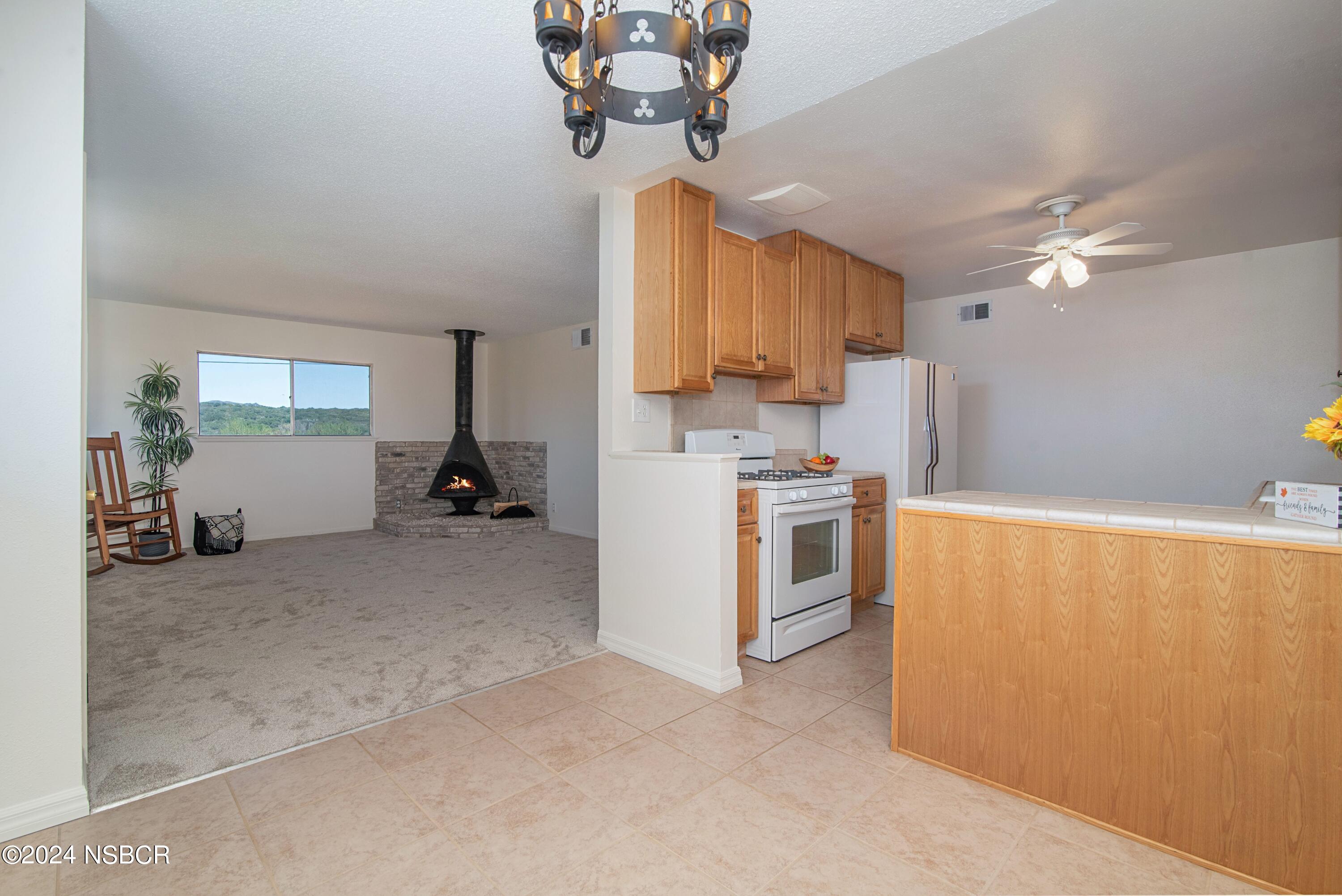 3380 Via Elba Lompoc, CA 93436 - Photo 5 of 23 a view of a kitchen with a sink cabinets and window